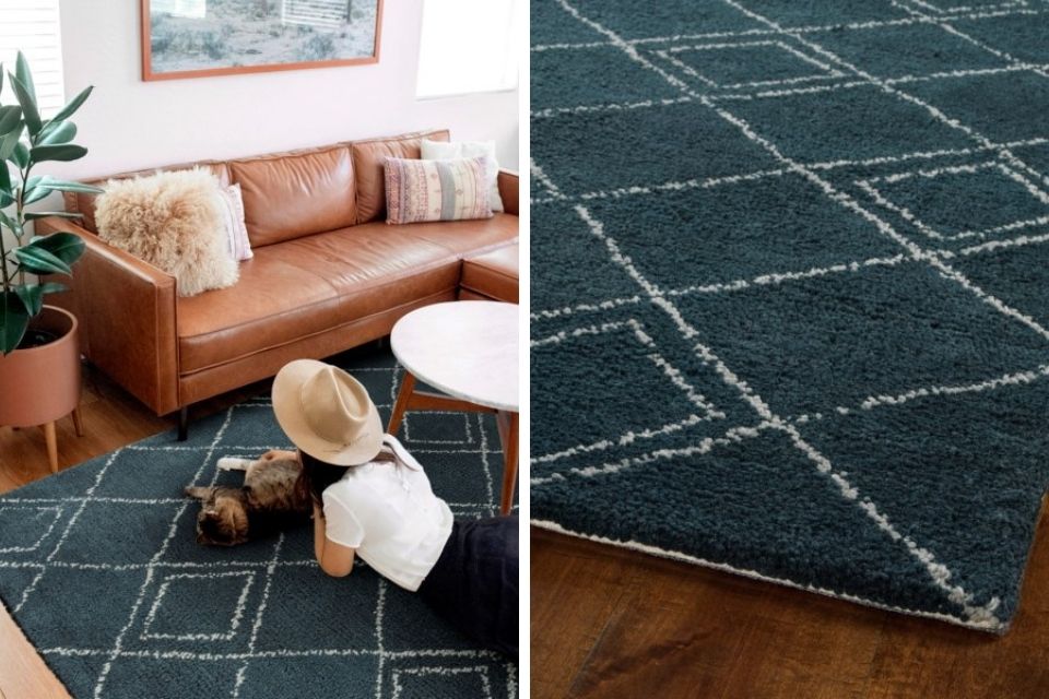 Mid-century modern blue area rug with brown leather couch 